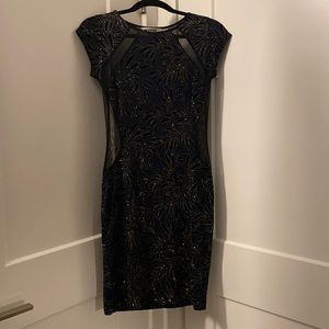 Hello I am selling a blue with gold dress size small.